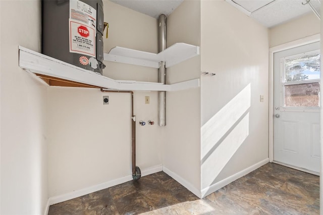 7112 2nd St N, Saint Petersburg, FL 33702 - washroom with electric dryer hookup, stone finish flooring, and water heater