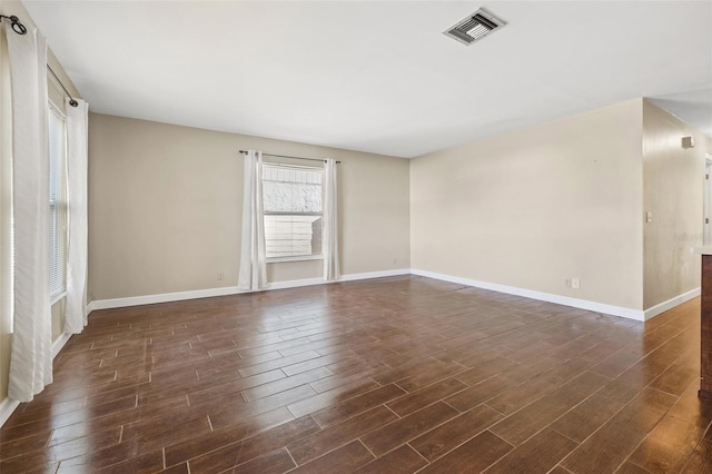 7112 2nd St N, Saint Petersburg, FL 33702 - spare room featuring dark wood-type flooring