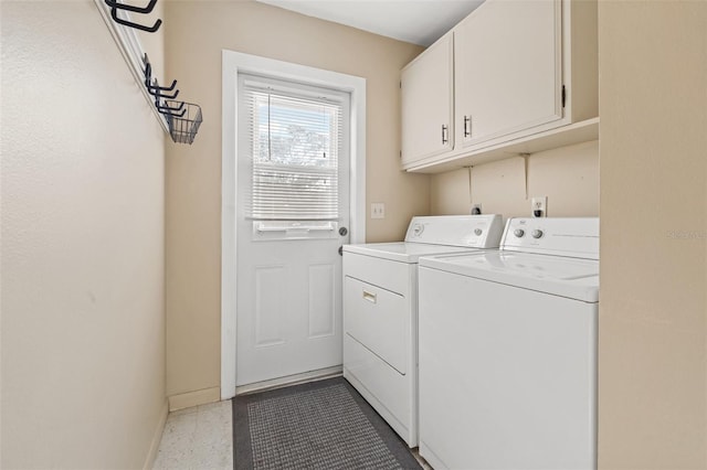 7112 2nd St N, Saint Petersburg, FL 33702 - laundry area with washer and dryer and cabinet space