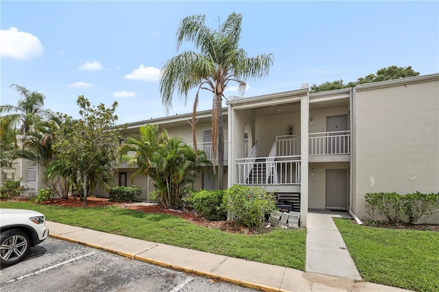 2625 State Road 590 Unit 723, Clearwater, FL 33759 - view of building exterior with uncovered parking
