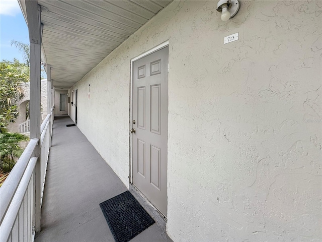 2625 State Road 590 Unit 723, Clearwater, FL 33759 - property entrance featuring stucco siding and a balcony
