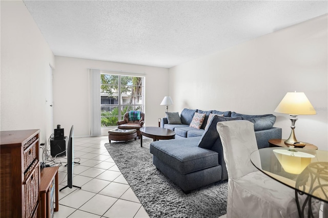 2625 State Road 590 Unit 723, Clearwater, FL 33759 - living area featuring light tile patterned floors and a textured ceiling