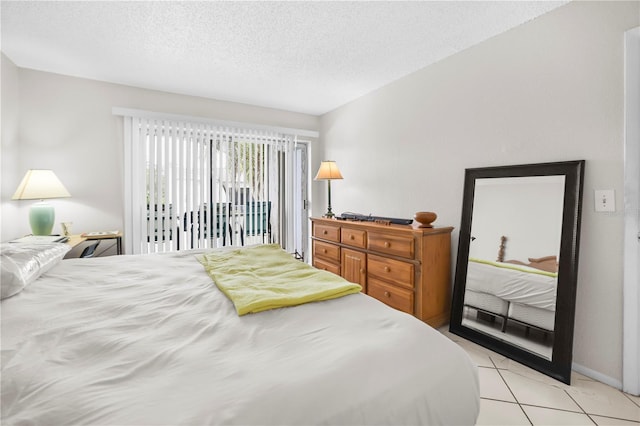 2625 State Road 590 Unit 723, Clearwater, FL 33759 - bedroom with light tile patterned floors and a textured ceiling