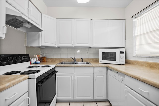 2625 State Road 590 Unit 723, Clearwater, FL 33759 - kitchen featuring white appliances, extractor fan, white cabinetry, and light countertops