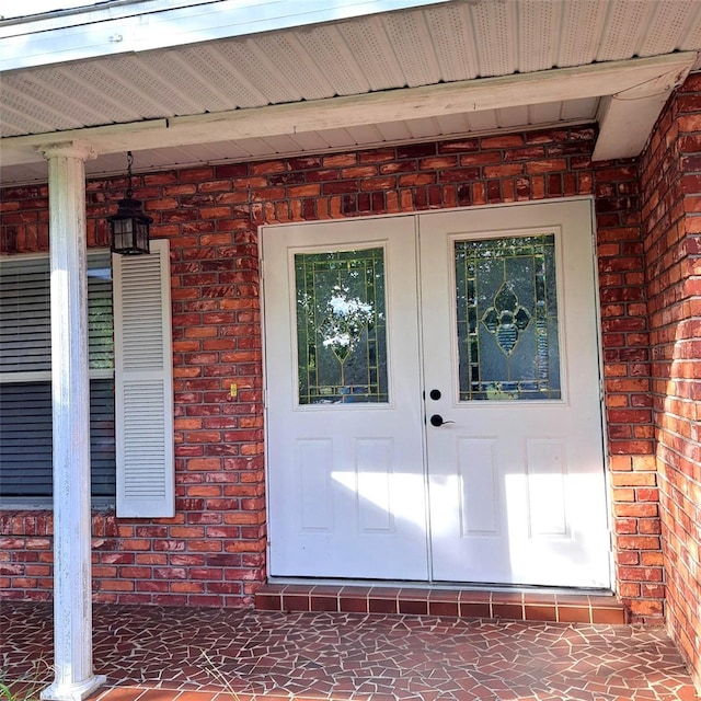 3645 E Country Side Dr, Inverness, FL 34452 - view of exterior entry with brick siding and french doors