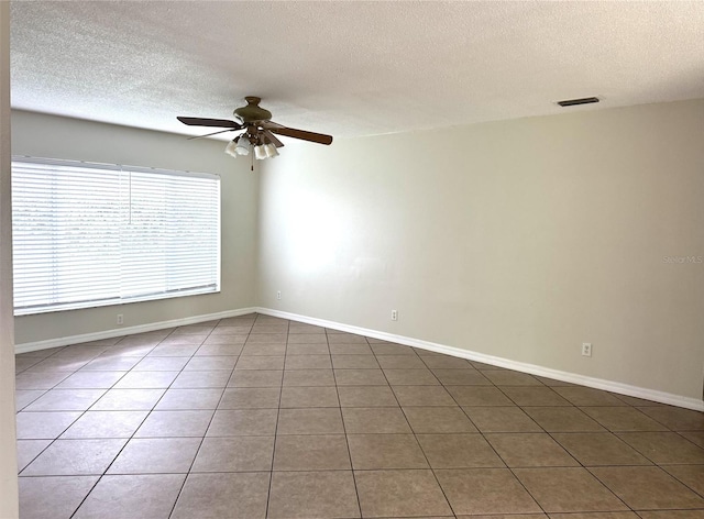 3645 E Country Side Dr, Inverness, FL 34452 - tiled empty room with a textured ceiling and ceiling fan