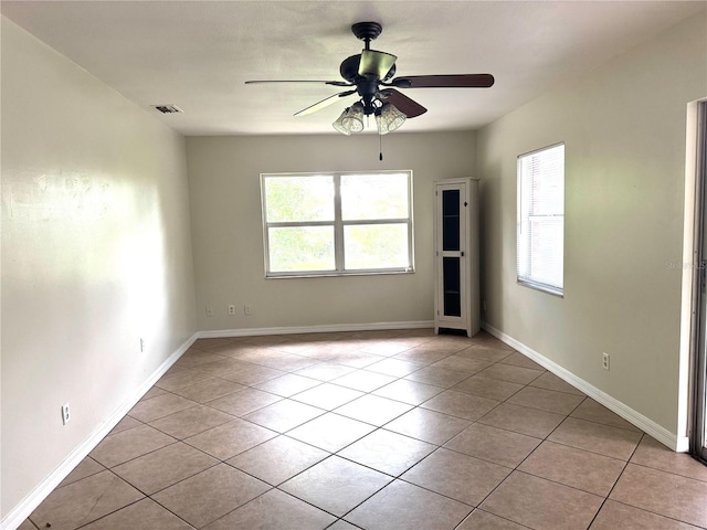 3645 E Country Side Dr, Inverness, FL 34452 - spare room with healthy amount of natural light, ceiling fan, and light tile patterned flooring