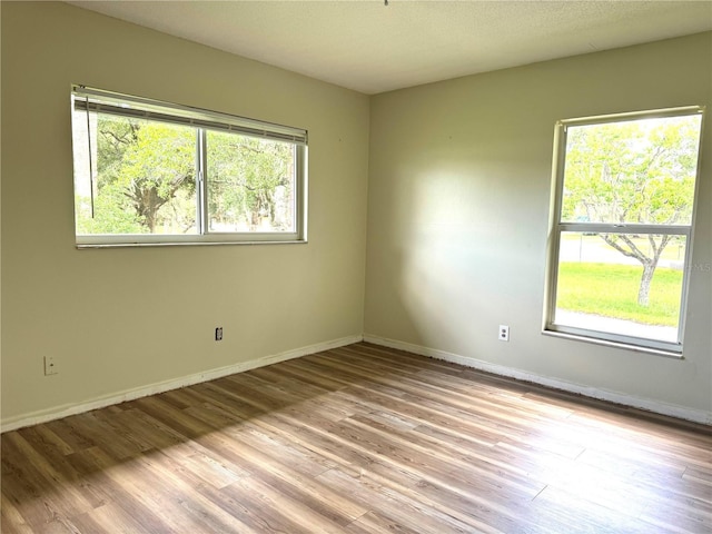 3645 E Country Side Dr, Inverness, FL 34452 - spare room featuring wood finished floors and baseboards