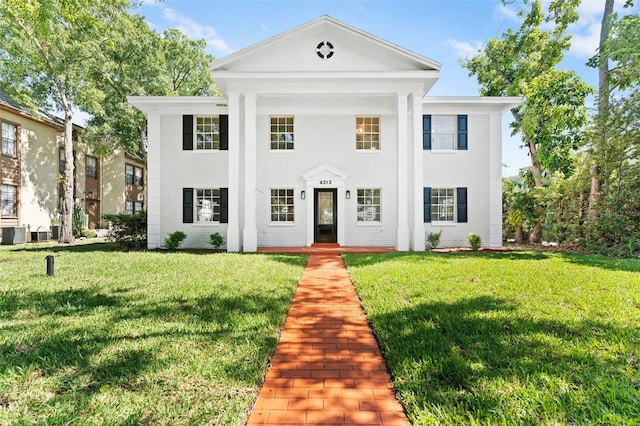 4313 W N A St, Tampa, FL 33609 - greek revival inspired property featuring a front yard and brick siding