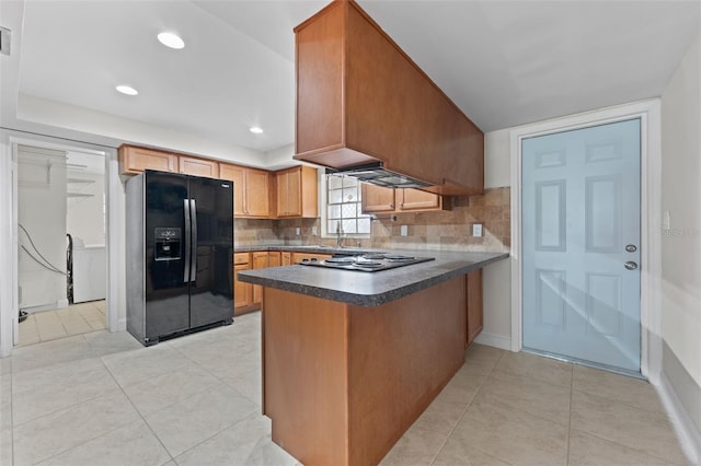 4313 W N A St, Tampa, FL 33609 - kitchen featuring black appliances, a peninsula, dark countertops, backsplash, and recessed lighting