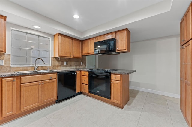 4313 W N A St, Tampa, FL 33609 - kitchen with black appliances, backsplash, brown cabinets, dark countertops, and recessed lighting