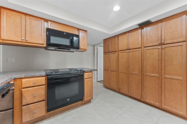 4313 W N A St, Tampa, FL 33609 - kitchen featuring black appliances, brown cabinetry, light tile patterned floors, and recessed lighting