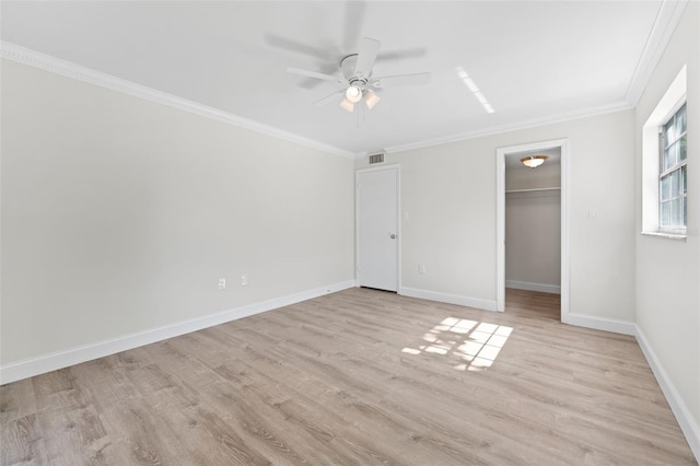 4313 W N A St, Tampa, FL 33609 - unfurnished bedroom with light wood finished floors, ornamental molding, a walk in closet, a ceiling fan, and a closet