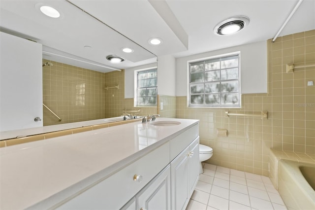 4313 W N A St, Tampa, FL 33609 - full bathroom featuring tile walls, tile patterned flooring, vanity, recessed lighting, and  shower combination