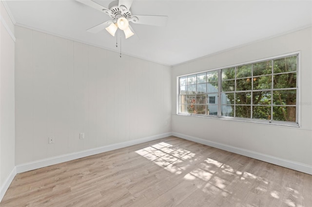 4313 W N A St, Tampa, FL 33609 - empty room featuring a ceiling fan, wood finished floors, and crown molding