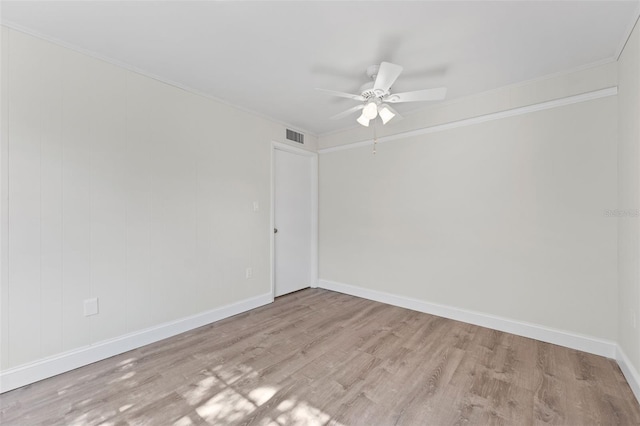 4313 W N A St, Tampa, FL 33609 - empty room featuring light wood-style floors, a ceiling fan, and crown molding