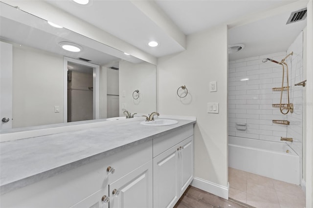 4313 W N A St, Tampa, FL 33609 - bathroom featuring vanity, washtub / shower combination, and recessed lighting