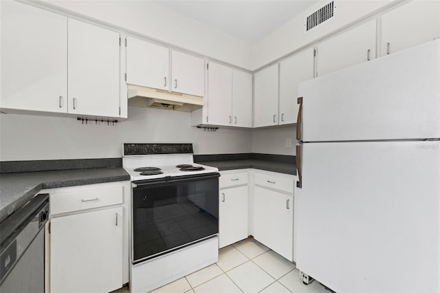4313 W N A St, Tampa, FL 33609 - kitchen featuring white appliances, under cabinet range hood, dark countertops, and light tile patterned flooring