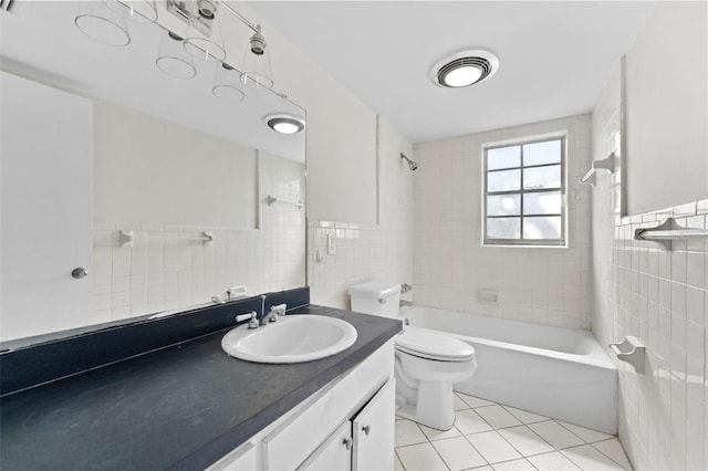 4313 W N A St, Tampa, FL 33609 - bathroom with tile walls, vanity, tile patterned flooring, and shower / bath combination