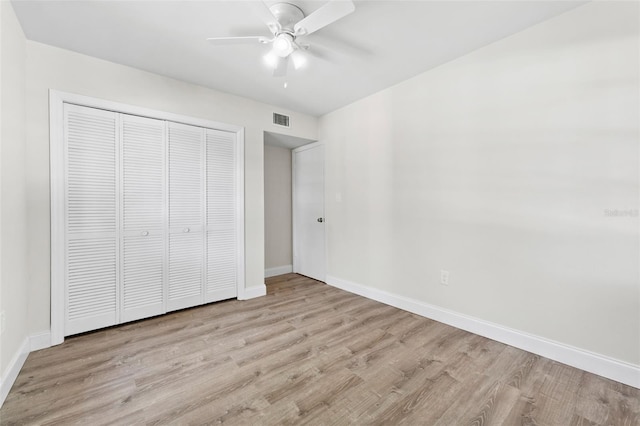 4313 W N A St, Tampa, FL 33609 - unfurnished bedroom featuring wood finished floors, a closet, and a ceiling fan