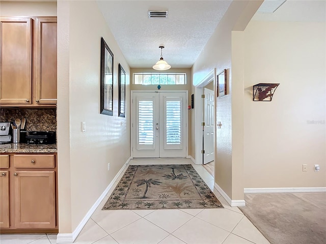 3409 61st Ter E, Ellenton, FL 34222 - entrance foyer with a textured ceiling and light tile patterned floors