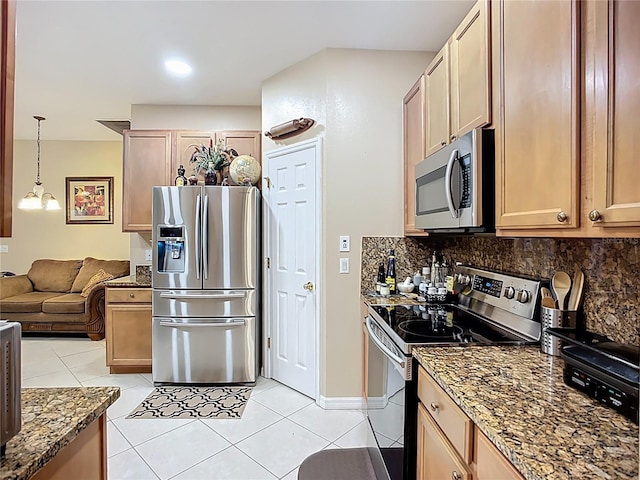 3409 61st Ter E, Ellenton, FL 34222 - kitchen with stainless steel appliances, light tile patterned floors, decorative backsplash, stone countertops, and open floor plan