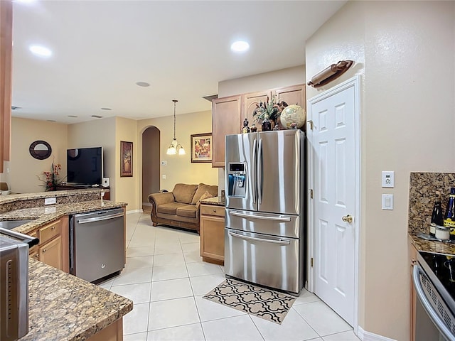 3409 61st Ter E, Ellenton, FL 34222 - kitchen featuring appliances with stainless steel finishes, arched walkways, open floor plan, light tile patterned floors, and decorative light fixtures