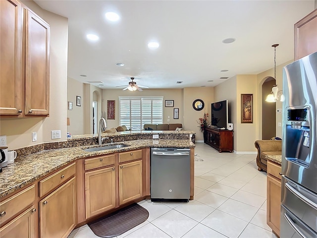 3409 61st Ter E, Ellenton, FL 34222 - kitchen with appliances with stainless steel finishes, a peninsula, ceiling fan, arched walkways, and open floor plan