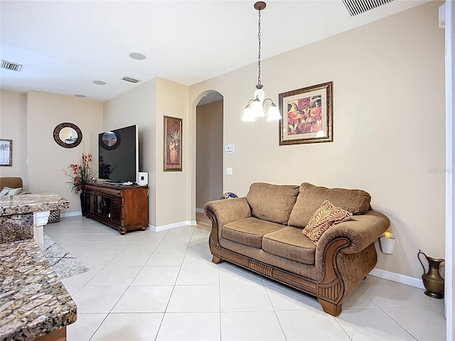 3409 61st Ter E, Ellenton, FL 34222 - living room featuring arched walkways and light tile patterned flooring