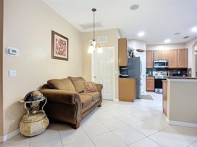3409 61st Ter E, Ellenton, FL 34222 - living area featuring arched walkways and light tile patterned flooring