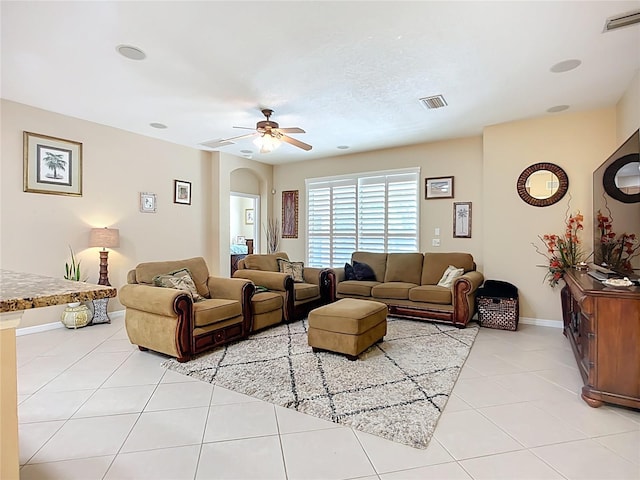 3409 61st Ter E, Ellenton, FL 34222 - living room featuring light tile patterned flooring, arched walkways, and ceiling fan
