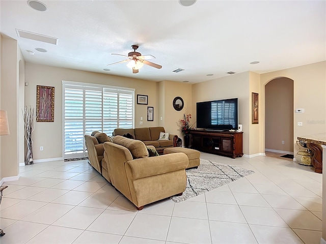 3409 61st Ter E, Ellenton, FL 34222 - living area featuring arched walkways, a ceiling fan, and light tile patterned floors
