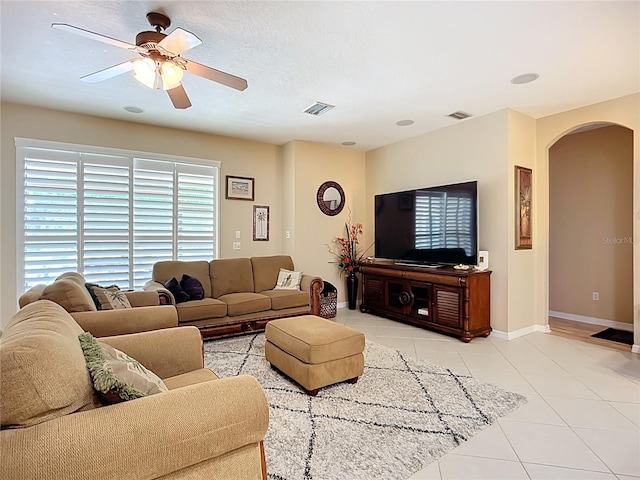 3409 61st Ter E, Ellenton, FL 34222 - living area featuring arched walkways, light tile patterned floors, and a ceiling fan