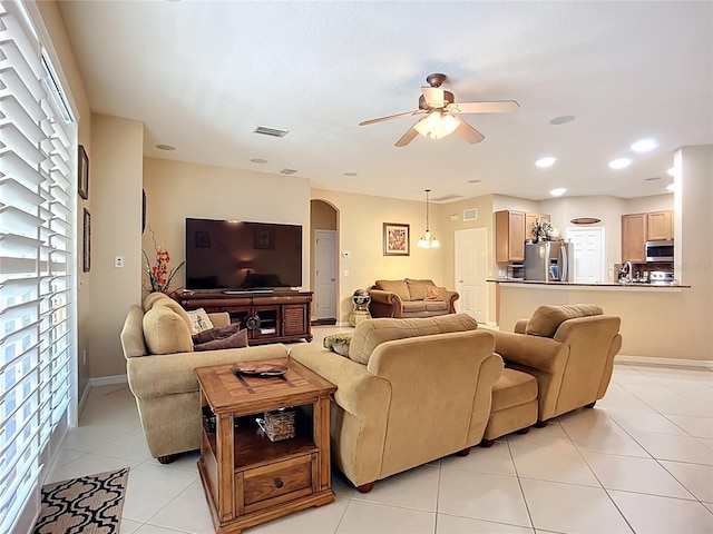 3409 61st Ter E, Ellenton, FL 34222 - living area featuring arched walkways, ceiling fan, light tile patterned floors, and recessed lighting