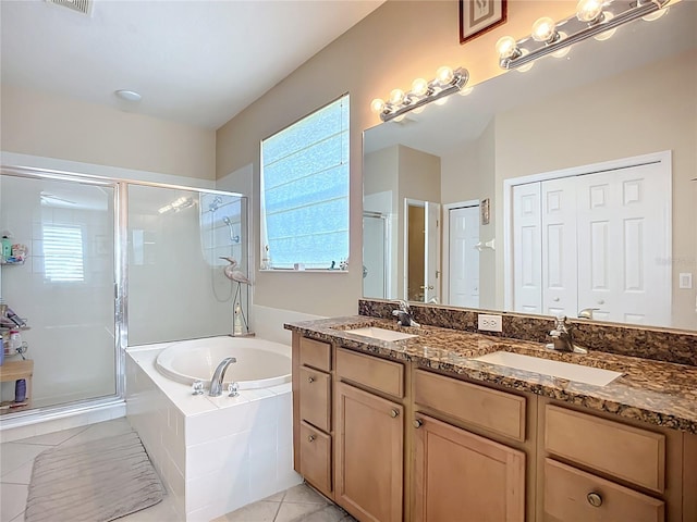 3409 61st Ter E, Ellenton, FL 34222 - full bathroom featuring a stall shower, double vanity, plenty of natural light, and a garden tub