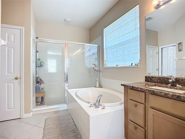 3409 61st Ter E, Ellenton, FL 34222 - bathroom with vanity, a bath, a shower stall, and tile patterned flooring