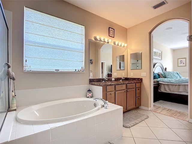 3409 61st Ter E, Ellenton, FL 34222 - ensuite bathroom featuring a bath, vanity, and tile patterned flooring