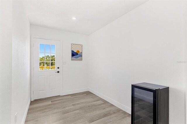 380 Colony Point Rd S, Saint Petersburg, FL 33705 - doorway featuring wine cooler, light wood finished floors, and recessed lighting
