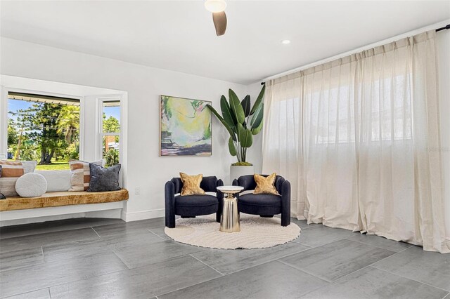 380 Colony Point Rd S, Saint Petersburg, FL 33705 - sitting room featuring baseboards and a ceiling fan