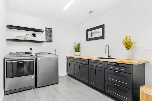 380 Colony Point Rd S, Saint Petersburg, FL 33705 - laundry area featuring separate washer and dryer and cabinet space