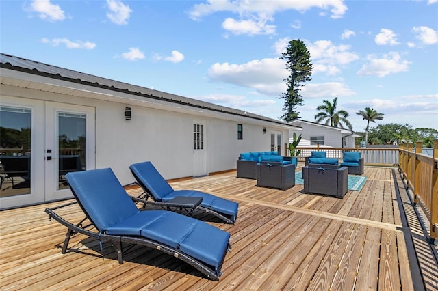 380 Colony Point Rd S, Saint Petersburg, FL 33705 - wooden deck featuring an outdoor living space and french doors