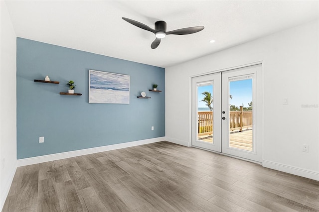 380 Colony Point Rd S, Saint Petersburg, FL 33705 - empty room with french doors, a ceiling fan, wood finished floors, and recessed lighting