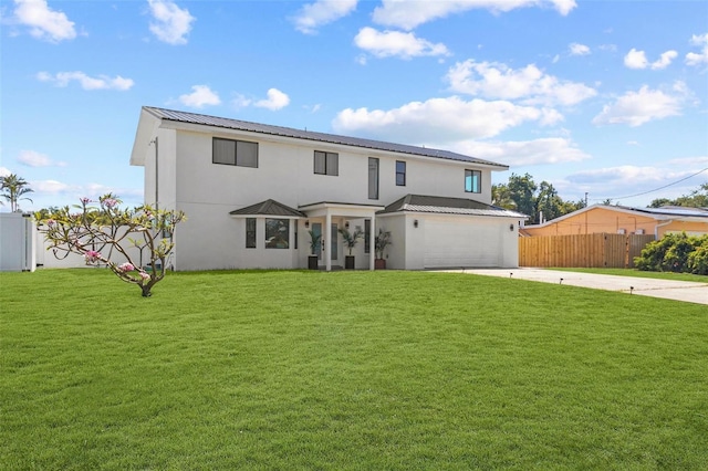 380 Colony Point Rd S, Saint Petersburg, FL 33705 - traditional home featuring concrete driveway, stucco siding, a metal roof, and a garage