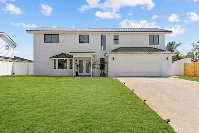380 Colony Point Rd S, Saint Petersburg, FL 33705 - view of front of home with french doors, stucco siding, a garage, driveway, and a metal roof