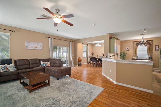 8607 Tidal Breeze Dr, Riverview, FL 33569 - living room with plenty of natural light, light wood-style flooring, and a ceiling fan