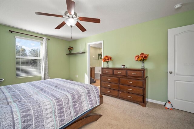 8607 Tidal Breeze Dr, Riverview, FL 33569 - bedroom featuring light colored carpet, ceiling fan, and connected bathroom