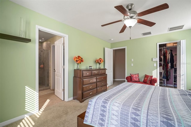 8607 Tidal Breeze Dr, Riverview, FL 33569 - bedroom featuring light carpet, a closet, ceiling fan, and ensuite bath