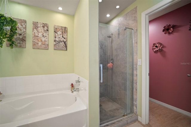 8607 Tidal Breeze Dr, Riverview, FL 33569 - bathroom with a bath, a shower stall, recessed lighting, and tile patterned flooring