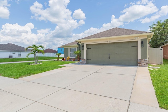 11913 Butler Woods Cir, Riverview, FL 33579 - single story home with concrete driveway, a front yard, stone siding, an attached garage, and stucco siding