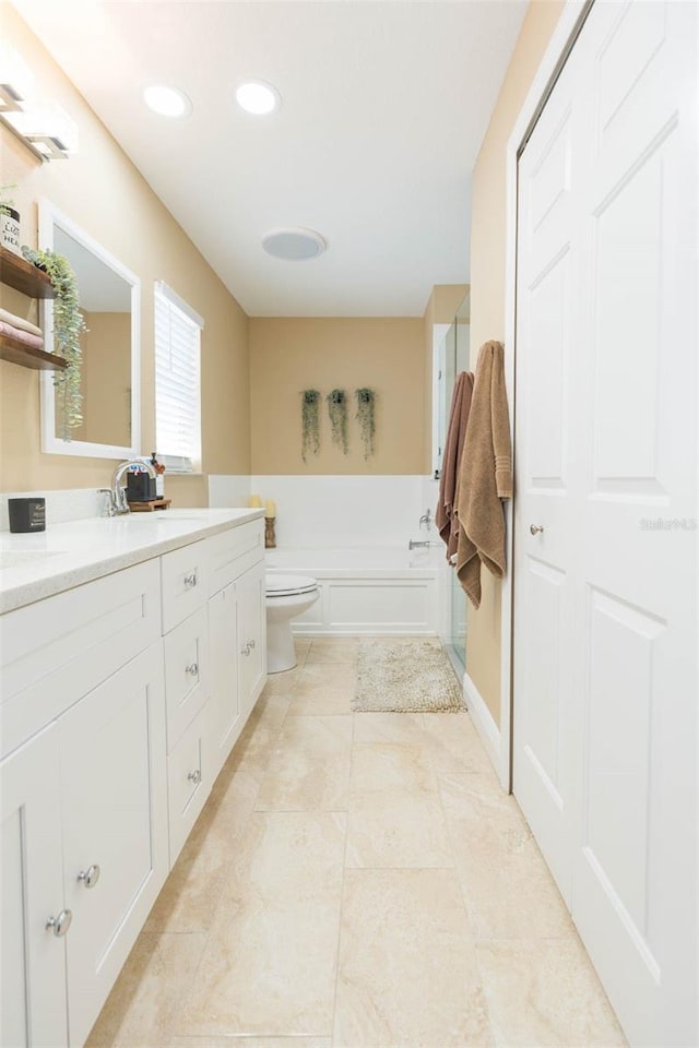 11913 Butler Woods Cir, Riverview, FL 33579 - bathroom with vanity, a bath, tile patterned flooring, and recessed lighting